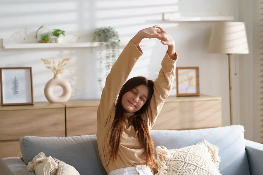 Woman stretching and smiling, feeling light and free